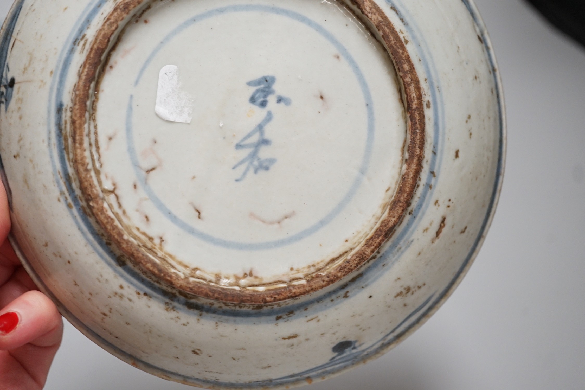 A Chinese blue and white bowl, tea bowl and saucer, and two other dishes, largest 29cm diameter